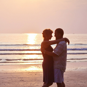 Couple at beach learning Maui Tantra